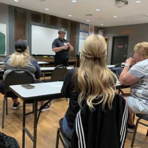 an instructor explaining to students in a classroom